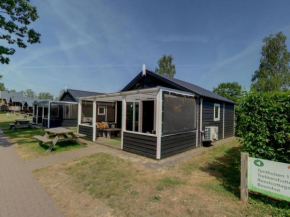 Tent lodge with covered terrace, in green area